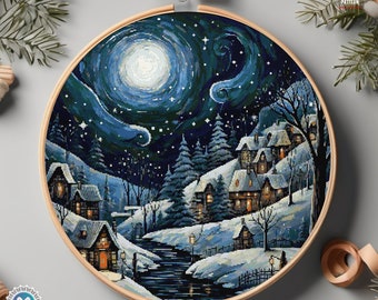 May include: Cross stitch pattern of a winter village scene with a full moon and stars in the sky. The village is covered in snow and there is a river running through it. The houses are lit up with warm lights.