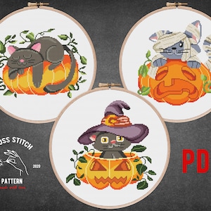 May include: Three cross stitch patterns featuring cute cats in pumpkins. The first pattern shows a black cat sleeping in a pumpkin. The second pattern shows a gray cat with a bandage on its head sitting in a pumpkin. The third pattern shows a black cat wearing a witch's hat sitting in a pumpkin.