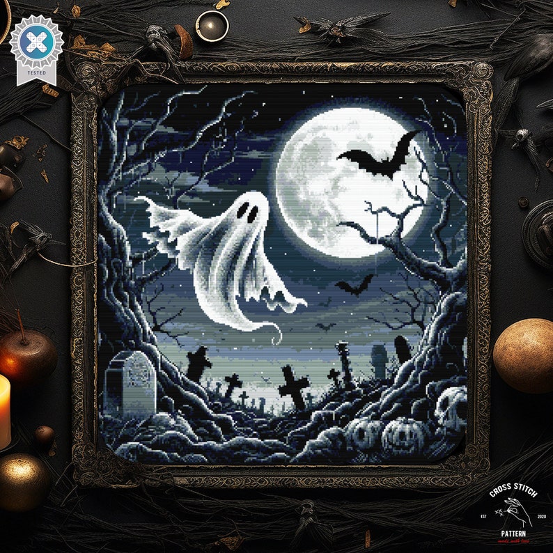 May include: A cross stitch pattern featuring a spooky Halloween scene with a ghost flying in front of a full moon, bats, and a graveyard. The pattern is in black, white, and gray.