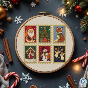 May include: A cross-stitch embroidery hoop featuring six Christmas-themed postage stamp designs. The stamps depict Santa Claus, a Christmas tree, a fox, a gingerbread house, a snowman, and angels. The hoop is set against a dark background with festive decorations.
