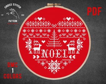 May include: A red cross stitch pattern with a white heart design featuring a Christmas tree, reindeer, and the word "NOEL".