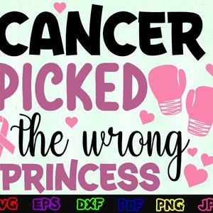 May include: Pink and black graphic design with the text "Cancer picked the wrong princess" and pink boxing gloves. The design includes a pink ribbon.