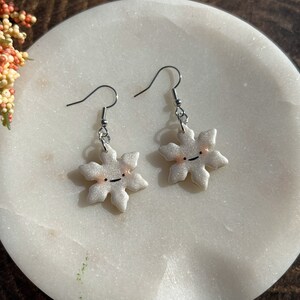 Glittery Pearl Blushing Snowflake Dangle and Drop Polymer Clay Earrings | Kawaii Smiling Snow Jewelry | Christmas Winter Holiday Gifts