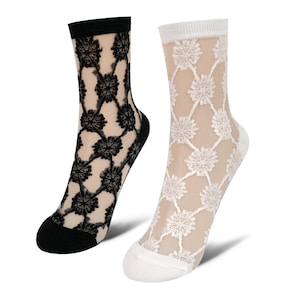 May include: Two pairs of sheer socks with floral lace patterns. One pair is black with a black floral design, and the other is white with a white floral design. The socks have black and white toes and cuffs.