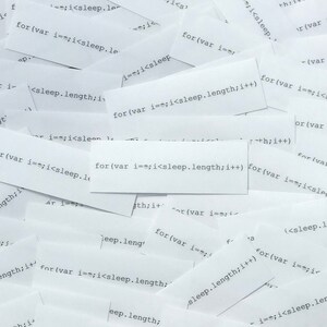 May include: A close-up of a pile of white paper scraps with the text "for (var i==;i<sleep.length;i++)" repeated on several of the scraps.
