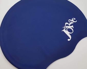 May include: A blue silicone swim cap with the word "JoRae" printed in white on the side.