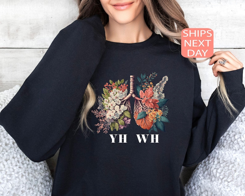 May include: Black sweatshirt with a floral print of lungs and the text "YH WH".