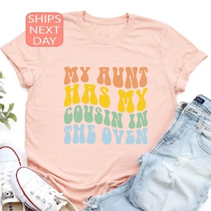 Camiseta infantil &quot;Minha tia colocou meu primo no forno&quot;, camiseta retrô com revelação de gravidez, camiseta estilosa &quot;Primo no forno&quot;, anúncio de gravidez da tia