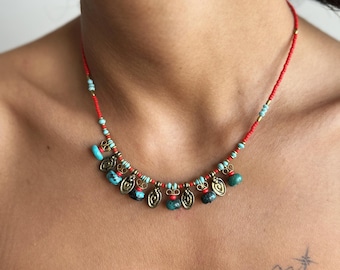 Handmade Boho Red Beaded Necklace with Turquoise Accents and Brass Charms - Ethnic Festival Jewelry
