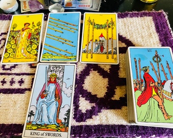 May include: A selection of tarot cards with vibrant illustrations. The cards displayed are the Nine of Pentacles, Eight of Wands, Four of Wands, King of Swords, and the Six of Wands. They are laid out on a purple and white patterned surface.