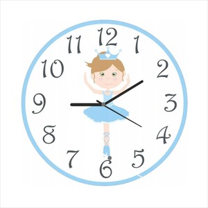 May include: A white clock face with blue trim and black hands. The clock face features a ballerina with a blue tutu and a crown. The numbers 1 through 12 are displayed around the clock face.