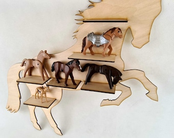May include: Wooden horse-shaped shelf with five shelves for displaying toy horses. The shelves are made of wood and are painted brown. The horse is painted brown and has a white mane and tail. There are five toy horses on the shelves, including a brown horse with a silver saddle, a brown horse, a brown horse with a black mane, a brown horse with a black mane, and a brown horse with a white mane.