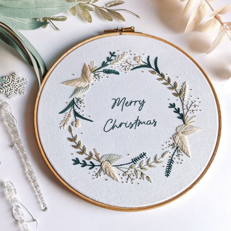 Merry Christmas Wreath Hand Embroidery Pattern Digital Download PDF by Tales from the Hoop. A beautiful festive design with winter florals berries and flowers in understated soft modern colours with metallic gold accents. Christmas handmade wall art.