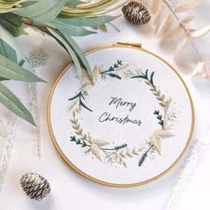 Merry Christmas Wreath Hand Embroidery Pattern Digital Download PDF by Tales from the Hoop. A beautiful festive design with winter florals berries and flowers in understated soft modern colours with metallic gold accents. Christmas handmade wall art.