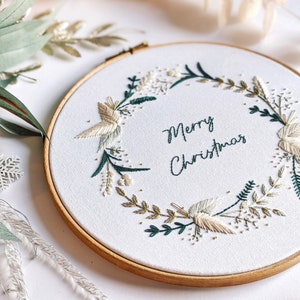Merry Christmas Wreath Hand Embroidery Pattern Digital Download PDF by Tales from the Hoop. A beautiful festive design with winter florals berries and flowers in understated soft modern colours with metallic gold accents. Christmas handmade wall art.