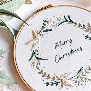 Merry Christmas Wreath Hand Embroidery Pattern Digital Download PDF by Tales from the Hoop. A beautiful festive design with winter florals berries and flowers in understated soft modern colours with metallic gold accents. Christmas handmade wall art.