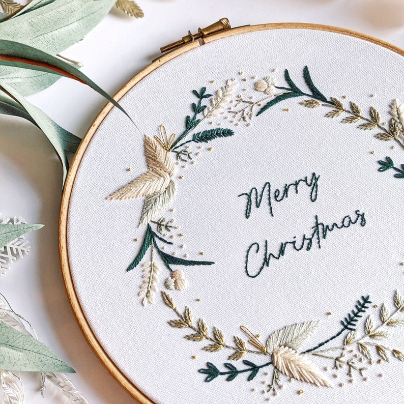 Merry Christmas Wreath Hand Embroidery Pattern Digital Download PDF by Tales from the Hoop. A beautiful festive design with winter florals berries and flowers in understated soft modern colours with metallic gold accents. Christmas handmade wall art.