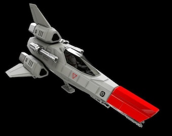 Puede incluir: Un modelo de nave espacial de color gris claro con una punta roja brillante, una cabina transparente y un estabilizador vertical. El fuselaje incluye cañones montados en los laterales, alas angulares y una pequeña marca triangular roja.