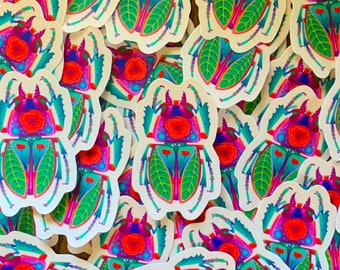 May include: A collection of colorful beetle stickers with intricate details. The beetles are depicted with vibrant green, pink, and blue colors, and feature floral patterns and intricate designs.