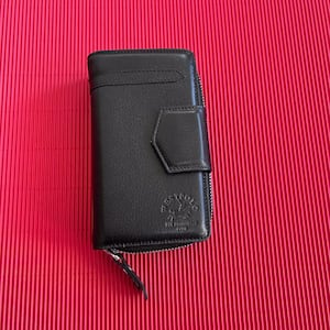 Cartera de piel para mujer.