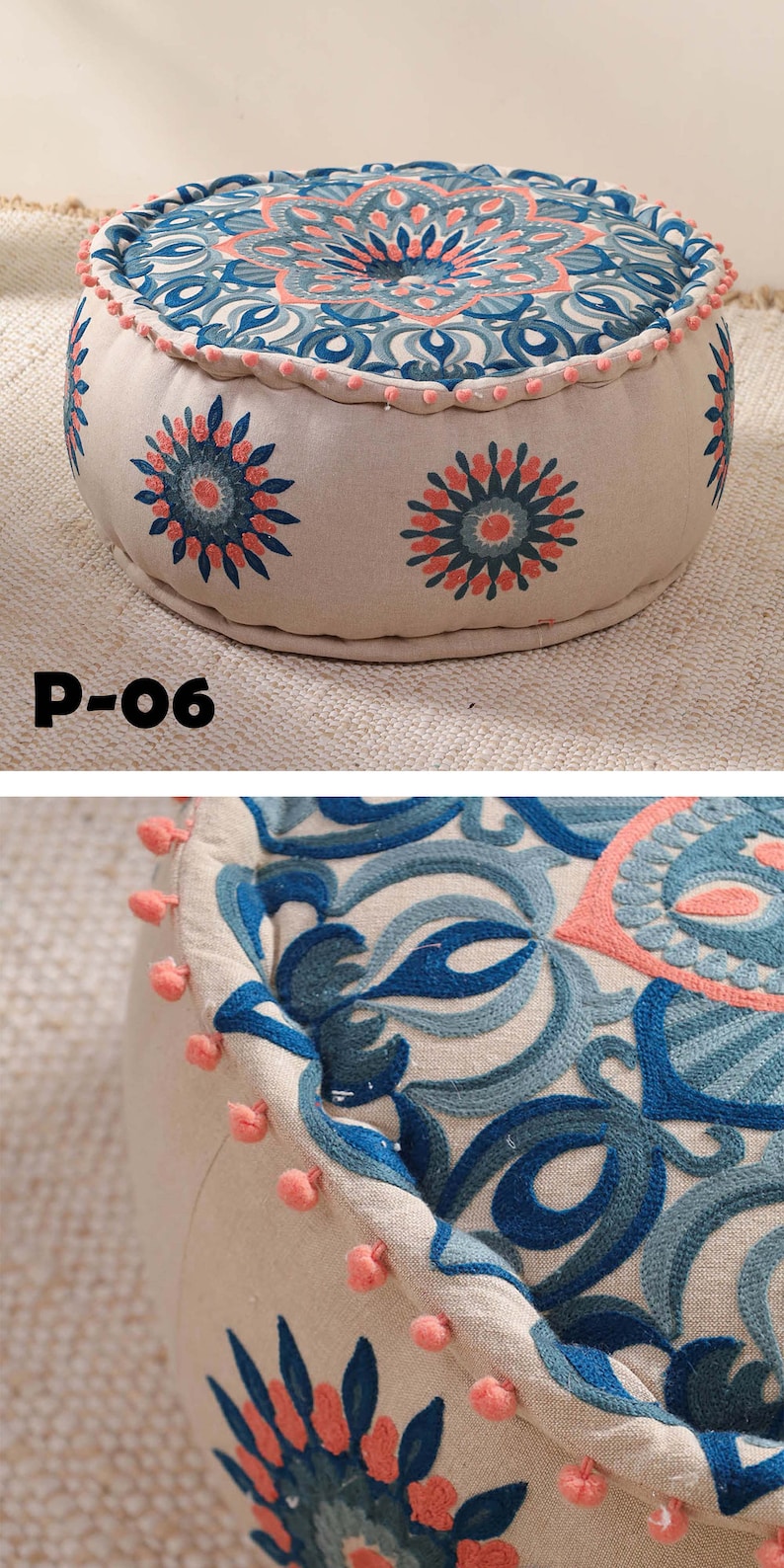 May include: A round, cream-colored ottoman with a blue and pink floral pattern. The ottoman has a pink pom-pom trim around the edge. The ottoman is labeled "P-06".