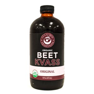May include: A glass bottle of organic beet kvass, labeled "Cultured Traditions" with the USDA organic seal. The bottle is 16 fluid ounces (473 ml) and the label says "Original".