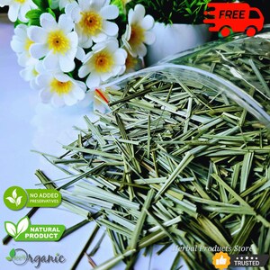 May include: A transparent bag containing dried green herbs, possibly lemongrass, with a bouquet of white flowers with yellow centres in the background. The image also includes text that reads "Herbal Products Store" and "Trusted".