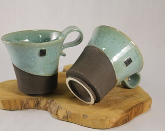 Set of two cups with enamelled stoneware handles