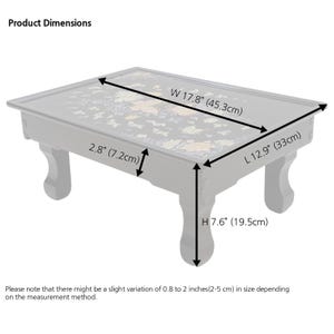 Product dimensions of a lacquered tray with butterfly and floral design 17.8W x 12.9L x 7.6H.