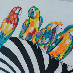 May include: A painting of four colorful parrots perched on a black and white zebra stripe pattern. The parrots are painted in a variety of bright colors, including red, yellow, blue, green, and orange.