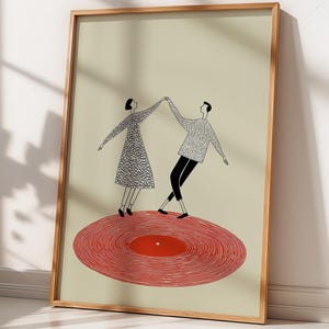 Puede incluir: Una impresión artística enmarcada que presenta a una pareja bailando sobre un disco de vinilo rojo. La ilustración es en blanco y negro, con los brazos de la pareja levantados. El fondo es de color beige claro y el marco es de madera.