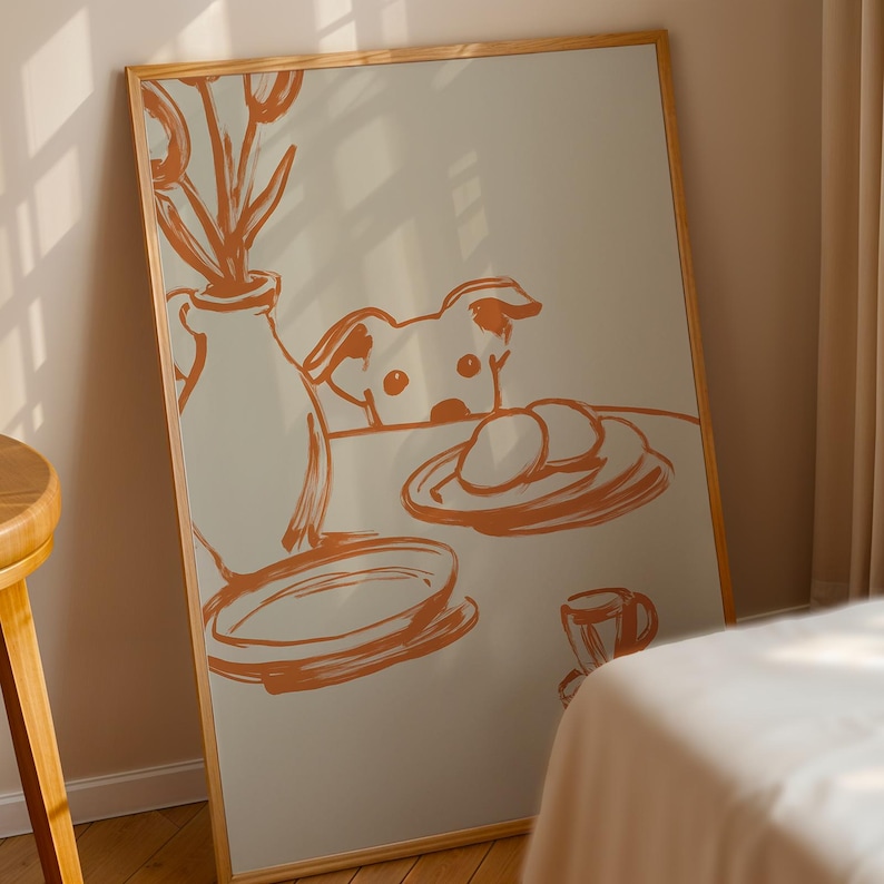 Minimalist terracotta line art poster featuring a curious dog peeking over a kitchen table. The still life scene includes a vase with flowers, plates, and a small coffee cup on a beige background. This modern hand-drawn illustration captures a cozy home or cafe vibe. Perfect as a gift for dog lovers, this aesthetic pet-themed wall decor fits boho and neutral interiors. High-quality physical print for kitchen, dining room, or living room wall art.