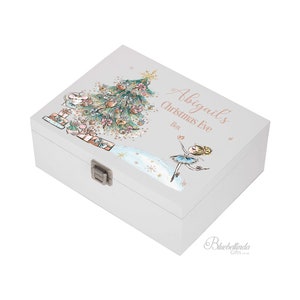 May include: White wooden keepsake box with a Christmas Eve design. The box features a ballerina, a Christmas tree, and the text "Abigail's Christmas Eve Box".