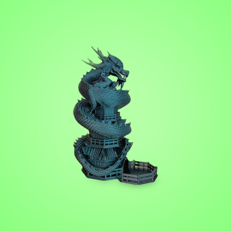 May include: A teal blue dragon wrapped around a tower-shaped dice tower. The tower has a removable lid and is made of plastic.