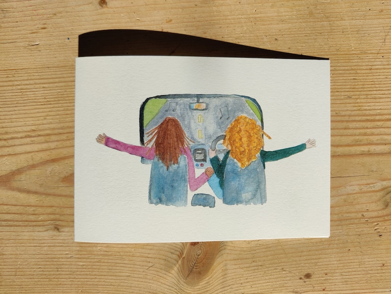 May include: Watercolor painting of two people in a car with their arms out the windows. The car is driving down a road with music notes in the air. The people are wearing blue jackets and have brown and blonde hair.