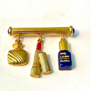 Estée Lauder rare vintage brooch with 3 charms