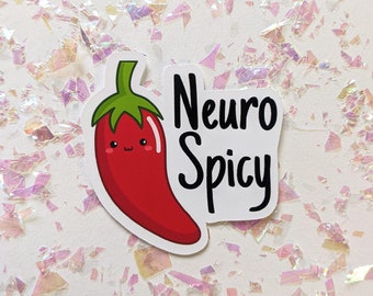 May include: A sticker featuring a red chili pepper with a smiling face and green stem. The text "Neuro Spicy" is printed in black next to the pepper. The background is white with iridescent glitter.