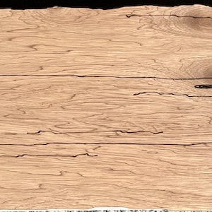 May include: Three pieces of light brown wood with dark brown knots and grain patterns. The wood is arranged in a horizontal stack.