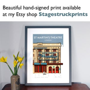 May include: A framed print depicting St Martin's Theatre in London, with a detailed illustration of the building's facade. The artwork includes the text "ST MARTIN'S THEATRE LONDON" and "The Mousetrap". The print is hand-signed and available at Stagestruckprints.