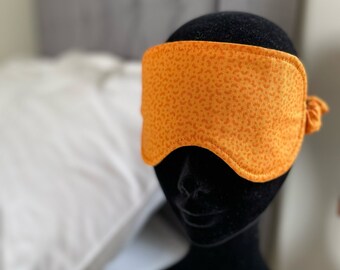 Upcycled sleep eye mask handmade in Ireland. Orange cotton sleeping mask. Sustainably made washable eye mask, blindfold, sleep aid