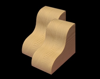 May include: Two wooden corner brackets with a wavy, textured surface. The brackets are light brown in color and are stacked on top of each other.