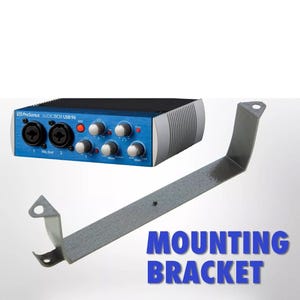 May include: A blue audio interface with silver detailing and a metal mounting bracket. The interface features several knobs and input jacks. The words "MOUNTING BRACKET" are in blue text.
