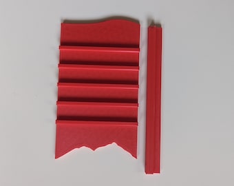 May include: A red plastic shelf unit with five shelves and a separate red plastic vertical piece.