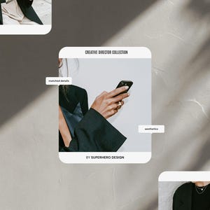 May include: A black blazer with a dark blue satin lapel detail, featuring the text CREATIVE DIRECTOR COLLECTION, matched details, aesthetics, and BY SUPERHERO DESIGN. The image displays a hand holding a black smartphone with gold rings on fingers.