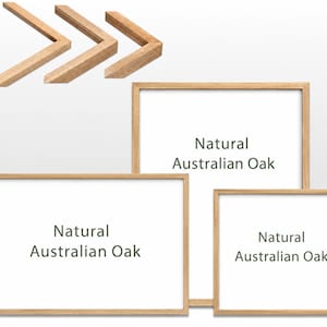 May include: Three rectangular picture frames made of light-coloured natural Australian oak wood. Each frame features a clean, simple design with a smooth finish. The text "Natural Australian Oak" is printed on the white centre of each frame.