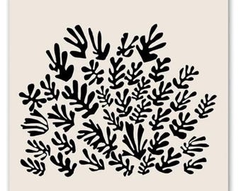 May include: A rectangular wall art print featuring a cream background with black organic, leaf-like shapes in the center. The text reads MATISSE PAPIERS DÉCOUPÉS at the top and BERGGRUEN & CIE 70, RUE DE L'UNIVERSITÉ, PARIS-VII Du Vendredi 27 Février au Samedi 28 Mars 1953 at the bottom.