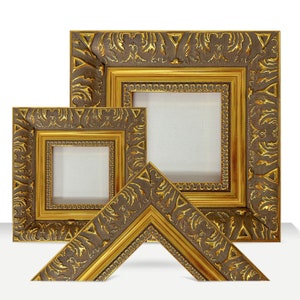 May include: Three ornate gold picture frames with intricate carvings and a dark brown finish. The frames are nested inside each other, with the largest frame in the back and the smallest frame in the front.