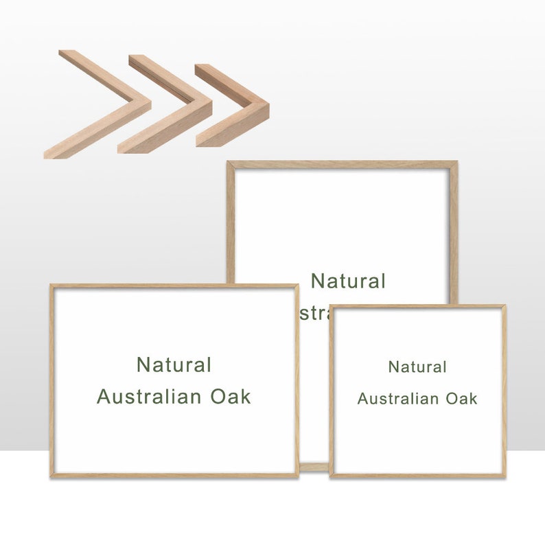 May include: Three framed art pieces with natural oak frames and white interiors. The frames are rectangular, with the text "Natural Australian Oak" printed on the white surface. Above the frames are three wooden corner pieces.