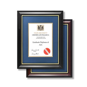 May include: A black and gold frame with a navy blue mount and a sample diploma inside. The diploma is for a Graduate Diploma of Arts. The text on the diploma reads "YOUR UNIVERSITY CERTIFICATE FRAMING".