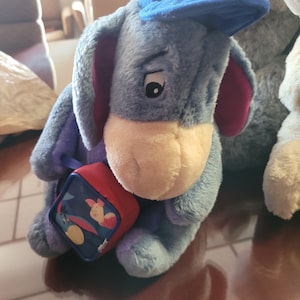 Disney Eeyore Plush Blue, Winnie The Pooh cap and backpack previously loved